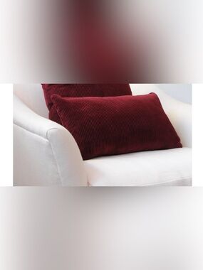 Rose Uniacke - small cushion in dark red corduroy